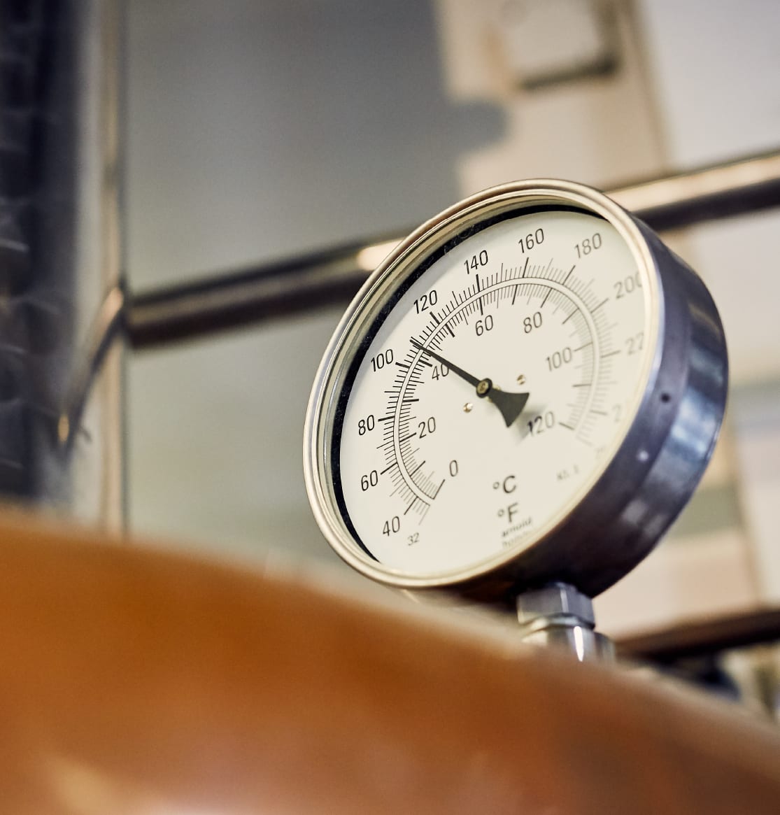 Temperature gauge mounted on a copper brewing vessel
