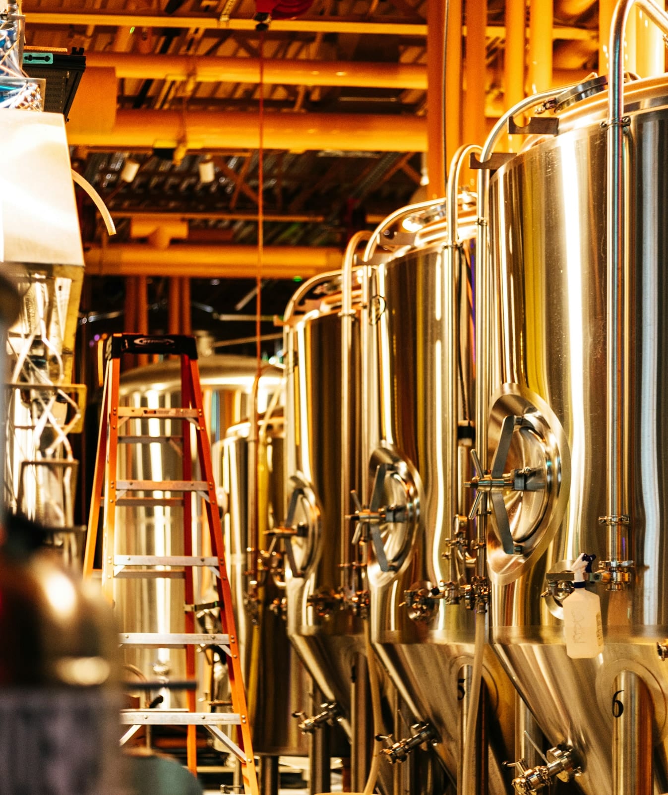 Copper and stainless steel brewing vessels in a brewery